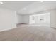 Expansive basement area with carpet and multiple windows offering natural light, perfect for customization at 24748 E 40Th Ave, Aurora, CO 80019