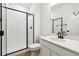Modern bathroom featuring a glass-enclosed shower, sleek fixtures, and a contemporary vanity at 24748 E 40Th Ave, Aurora, CO 80019