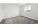 Clean bedroom with carpet and a window overlooking the neighborhood at 24748 E 40Th Ave, Aurora, CO 80019