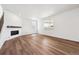 Spacious living room with wood floors, a fireplace, and lots of natural light at 24748 E 40Th Ave, Aurora, CO 80019