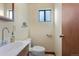 Half bathroom with vanity and natural light at 874 Mercury Cir, Lone Tree, CO 80124