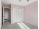 Bedroom with carpet and white closet doors at 874 Mercury Cir, Lone Tree, CO 80124