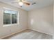 Neutral bedroom with carpet, window, and ceiling fan offers a bright, relaxing space at 874 Mercury Cir, Lone Tree, CO 80124