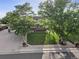 Beautiful two-story home with mature trees, a well-manicured lawn, and appealing landscaping at 874 Mercury Cir, Lone Tree, CO 80124