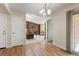 Bright living room featuring hardwood floors, a fireplace, and built-in bookshelves at 874 Mercury Cir, Lone Tree, CO 80124