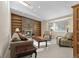 Cozy living room with a brick fireplace, built-in shelves, and plenty of natural light at 874 Mercury Cir, Lone Tree, CO 80124