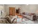 Inviting living room with wood floors, neutral tones, and a glimpse of the kitchen at 874 Mercury Cir, Lone Tree, CO 80124