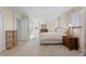 Spacious carpeted main bedroom with ceiling fan, dresser, and two windows with light filtering curtains at 874 Mercury Cir, Lone Tree, CO 80124