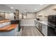 Basement bar with cabinetry, refrigeration and stone pillar accent at 20148 E Windy Pine Pl, Parker, CO 80134