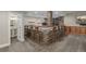 Bar area with seating, stone features, and access to bathroom at 20148 E Windy Pine Pl, Parker, CO 80134
