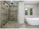 Luxurious bathroom features glass enclosed shower and standalone tub at 20148 E Windy Pine Pl, Parker, CO 80134