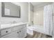 Bright bathroom with single sink vanity and shower-tub combination at 20148 E Windy Pine Pl, Parker, CO 80134