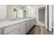 Bathroom with double vanity, granite countertops and hardwood floors at 20148 E Windy Pine Pl, Parker, CO 80134