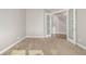 Carpeted room with glass french doors leading to a staircase and natural light at 20148 E Windy Pine Pl, Parker, CO 80134