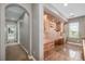 Hallway with built-in desk, drawers, cabinets, and hardwood floors at 20148 E Windy Pine Pl, Parker, CO 80134