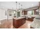 Updated kitchen with a center island, granite countertops, and pendant lighting at 20148 E Windy Pine Pl, Parker, CO 80134