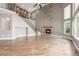 Spacious living room with a stone fireplace and large windows for natural light at 20148 E Windy Pine Pl, Parker, CO 80134