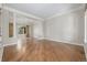 Open living room features hardwood floors, large windows, and decorative columns at 20148 E Windy Pine Pl, Parker, CO 80134