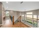 Loft space features stone fireplace, hardwood floors, and a bright view at 20148 E Windy Pine Pl, Parker, CO 80134