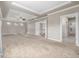Large main bedroom boasts tray ceilings, neutral carpet, and multiple windows at 20148 E Windy Pine Pl, Parker, CO 80134