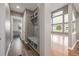 Mudroom with built-in storage, bench, and view to the living room at 20148 E Windy Pine Pl, Parker, CO 80134
