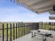 Balcony with views of lush landscaping and trees at 480 S Marion Pkwy # 901, Denver, CO 80209