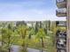 A scenic view from the balcony showcases a park and a lake at 480 S Marion Pkwy # 901, Denver, CO 80209