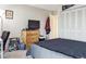Cozy bedroom featuring a TV on a dresser and ample closet space at 480 S Marion Pkwy # 901, Denver, CO 80209