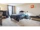 Spacious bedroom featuring a large window, a study desk, and a comfortable bed at 480 S Marion Pkwy # 901, Denver, CO 80209