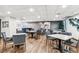 Bright dining area featuring modern tables, chairs, and stylish decor at 480 S Marion Pkwy # 901, Denver, CO 80209