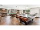 Spacious game room with pool table, foosball, and cozy bar area at 480 S Marion Pkwy # 901, Denver, CO 80209