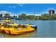 A peaceful lake view featuring colorful paddleboats near the shoreline at 480 S Marion Pkwy # 901, Denver, CO 80209