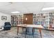 Community library with bookshelves filled with books and a quiet study area at 480 S Marion Pkwy # 901, Denver, CO 80209