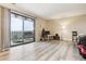 Bright living room with sliding glass doors opening to balcony at 480 S Marion Pkwy # 901, Denver, CO 80209