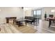 Bright living room with modern furnishings and sliding glass doors to a balcony at 480 S Marion Pkwy # 901, Denver, CO 80209