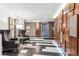 The condo's lobby boasts modern decor and comfortable seating near elevators at 480 S Marion Pkwy # 901, Denver, CO 80209