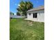 Lush green backyard with a patio and a white fence, perfect for relaxation and entertaining guests at 5010 Golden Eagle Pkwy, Brighton, CO 80601