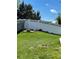 Well-manicured backyard with a white fence creating a private and serene outdoor space at 5010 Golden Eagle Pkwy, Brighton, CO 80601