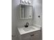 Bathroom featuring a modern vanity with a white countertop and black faucet at 5010 Golden Eagle Pkwy, Brighton, CO 80601