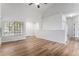 Bright living room boasts wood floors, vaulted ceilings, a front door, and plenty of natural light at 5010 Golden Eagle Pkwy, Brighton, CO 80601