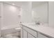 Clean bathroom with a tub-shower combo, modern vanity, and stylish tile flooring at 7260 Waterleaf Trl, Littleton, CO 80125