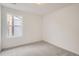 Comfortable bedroom featuring neutral carpet, a window, and fresh paint, ideal for rest at 7260 Waterleaf Trl, Littleton, CO 80125