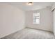 Cozy bedroom with soft carpet, a window, and sliding closet doors, perfect for relaxation at 7260 Waterleaf Trl, Littleton, CO 80125