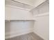 Spacious walk-in closet with ample shelving and rod space, providing organized storage solutions at 7260 Waterleaf Trl, Littleton, CO 80125