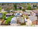 Aerial view of home with detached garage and backyard entertaining area at 822 Poplar St, Denver, CO 80220
