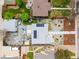 A high angle view of the home with solar panels, outdoor living space, and a modern landscape design at 822 Poplar St, Denver, CO 80220