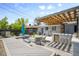 Beautiful backyard with custom pergola, outdoor kitchen, composite deck, and seating area at 822 Poplar St, Denver, CO 80220