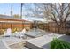 Tranquil backyard retreat with serene water feature and mature landscaping at 822 Poplar St, Denver, CO 80220