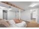 Finished basement bedroom with a bed, shelving, and a walk-in closet at 822 Poplar St, Denver, CO 80220
