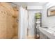 Shower with decorative shelving and chrome fixtures at 822 Poplar St, Denver, CO 80220